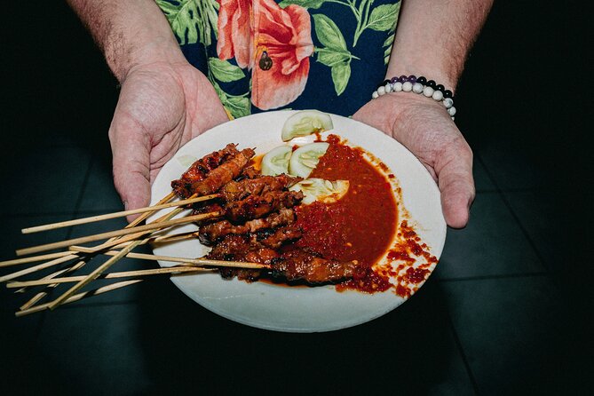 Bali Bites Food Tour with 15+ Tastings - Badung Market at night: fruit, snacks, and the pace of real trade