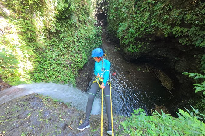 Bali Canyoning Trip – Explore Hidden Waterfalls & Gorges - The second half: slides, jumps, trekking, and a zip line into the canyon