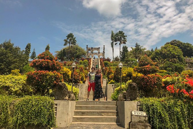 East Bali Tour, Lempuyang - Tirta Gangga - Ujung Soekasada - Black sand Beach - Tirta Gangga: Koi Ponds, Clear Water, and a Fun Trick With Fish Food