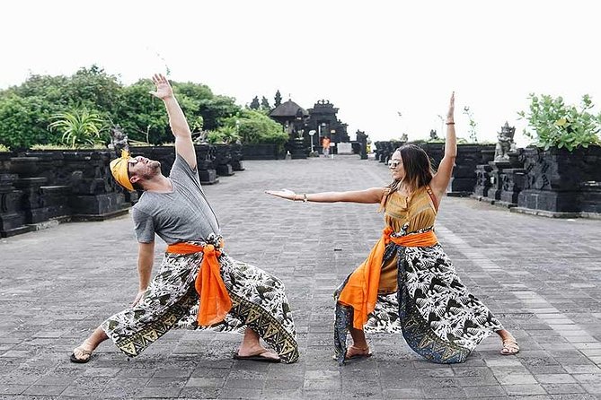 Half-Day Taman Ayun UNESCO and Tanah Lot Temple with private Car - Taman Ayun’s bridge-to-garden approach near Mengwi