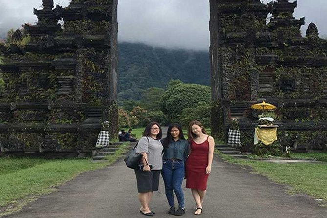 Private Tour: Ulun Danu Temple-Handara Gate-Wana Giri Hill&Tanah Lot Sunset - Stop 1: Handara Iconic Gate photo time with the mountain backdrop