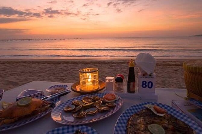 Private Tour Uluwatu Sunset Kecak Dance and Dinner at Jimbaran - Jimbaran Bay after dark: seafood on the beach, but budget for it