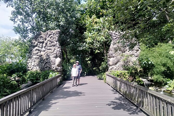 Rafting Swing Monkey Forest And Waterfall Tour All Inclusive - Stop 3: Sacred Monkey Forest Sanctuary with bridges, statues, and long-tailed monkeys